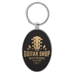 Black/Gold 3" x 1 3/4" Laserable Leatherette/Metal Oval Keychain